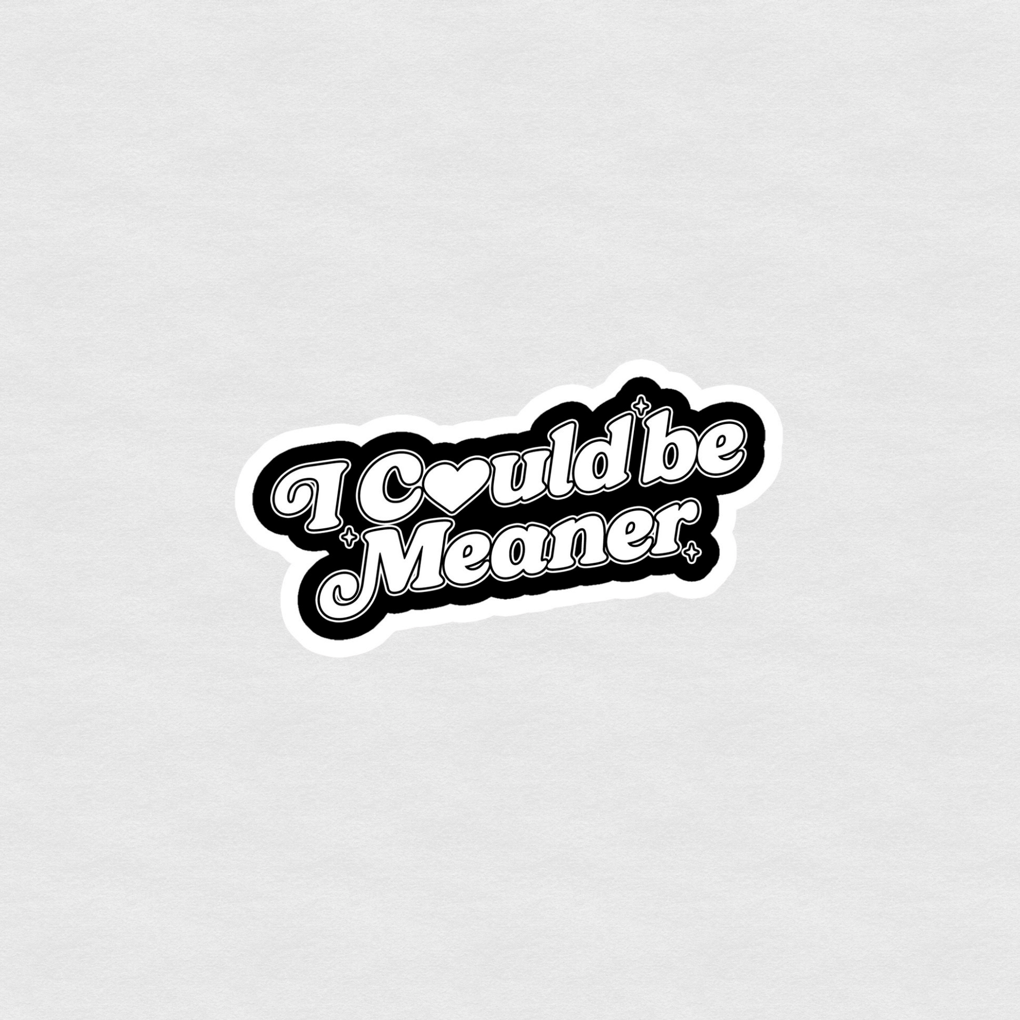 Black and white script sticker reading “I could be meaner” with small star accents