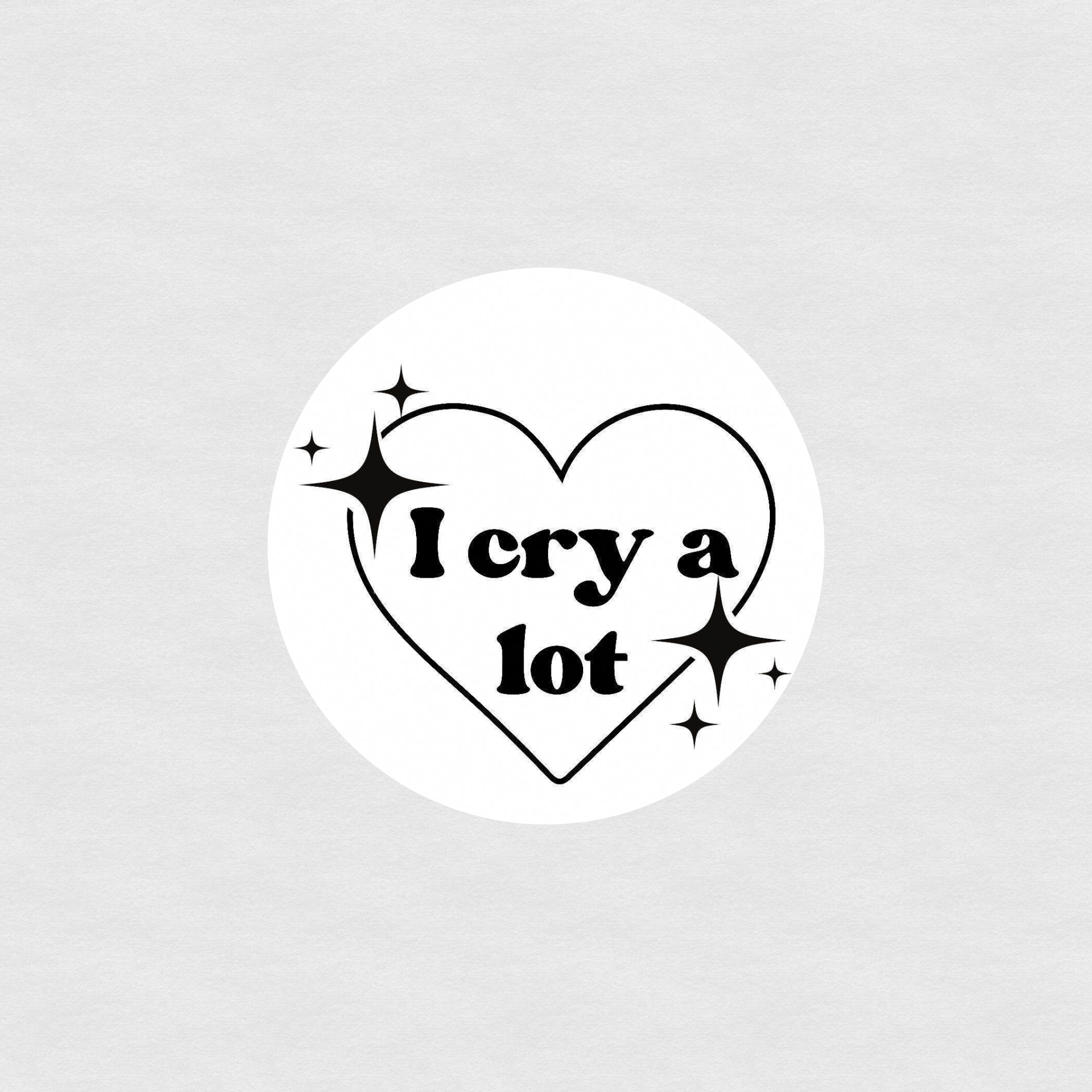 Black and white heart sticker with sparkles and text reading “I cry a lot”
