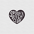 Black heart-shaped sticker with white gothic text reading “Spooky Bitch Club”